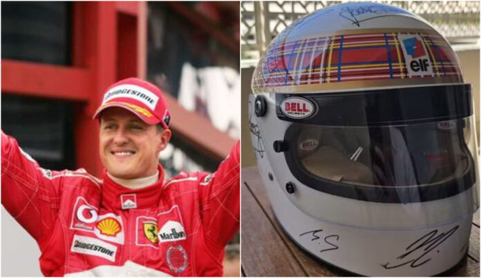 com-ajuda-da-esposa,-schumacher-assina-capacete-em-rara-aparicao-em-tributo-da-formula-1